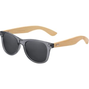 Sunglasses with grey lenses and wooden arms, featuring a logo on the frame. Ideal for leisure and outdoor activities.