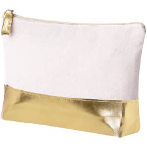 A toiletry bag featuring a cream fabric body and a shiny gold metallic base, with a zip closure and branding.