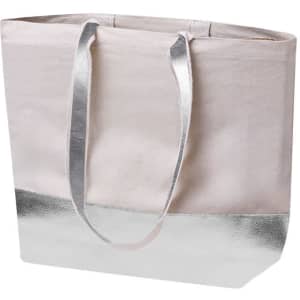 A tote bag in light pink with a metallic silver bottom and matching handles, featuring a logo.
