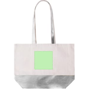 A tote bag in cream with a silver bottom and two long handles. It features a blank green square for customisation.