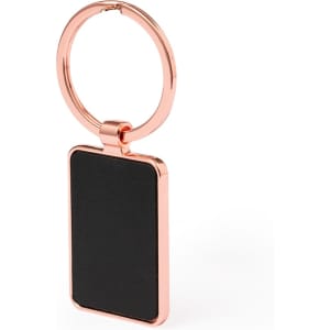 A rose gold keyring with a rectangular black tag and a circular loop for attaching keys.