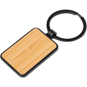 A rectangular keyring with a wooden textured surface and a black metal loop for attachment.