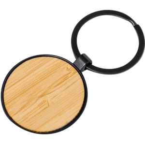 A round keyring with a black metal frame and a bamboo-style wooden centre.