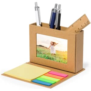 A multi-functional pencil holder in brown with slots for pens, sticky notes, and a photo frame.