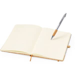 An open notebook with lined pages and a silver pen resting on it. The notebook features a tan cover.