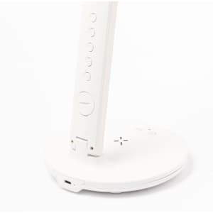 A white multifunction lamp with a circular base and control buttons on the stand, featuring a charging port.