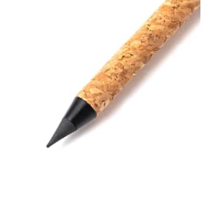 A pencil with a textured cork body and a black tip, featuring a simple design.