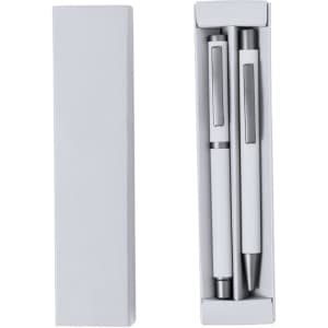 A box containing two metal pens, one with a smooth barrel and the other with a clip, in sleek white.