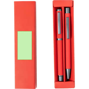 A red box containing two red metal pens with black accents and a logo.