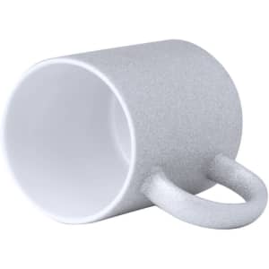 A coffee mug in a glittery silver finish with a white interior and a curved handle. It features a logo.