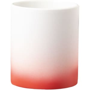 A coffee mug in white with a gradient that transitions to a vibrant red at the bottom. It features a logo.
