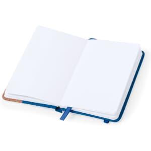An open blue notepad with blank pages and a ribbon bookmark, featuring a textured cover.