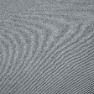 A close-up of grey polar fleece fabric, featuring a textured, diagonal pattern. It has a subtle sheen and softness.