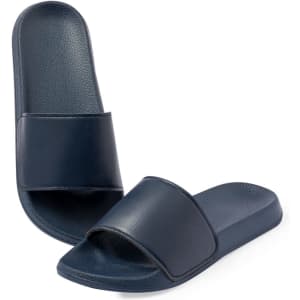 Navy blue Kanger flip flops, featuring a smooth strap and flat sole, with a branding logo on the upper.