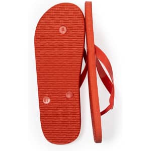 A pair of red flip flops with textured soles and slim straps, featuring a logo on each sole.