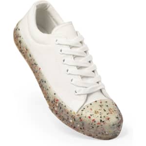 A white sneaker with a speckled multi-coloured sole and laces, featuring a logo on the side.