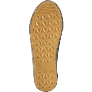 The underside of a shoe with a patterned rubber sole, featuring a brown and multi-coloured design.