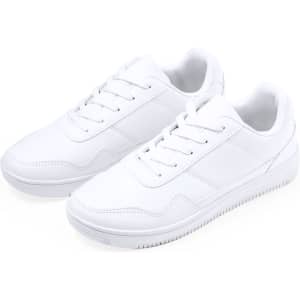 White trainers with a sleek design, featuring a lace-up front and a textured sole. The footwear includes a branding logo.