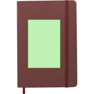 A brown notepad with a green stitched decorative border and an elastic closure. It features a logo on the cover.