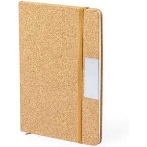 A cork notebook with an elastic band closure and a clear pocket on the cover.