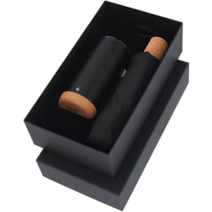 A drink bottle and umbrella set in a black box, featuring a black thermos with a cork lid.