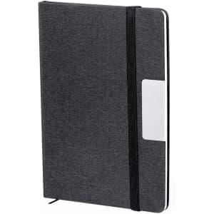 A grey notebook with an elastic closure and a label pocket on the cover. It has a textured finish and a logo.