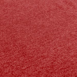 A close-up of a textured red fabric, featuring a slightly heathered pattern. The fabric appears soft and lightweight.