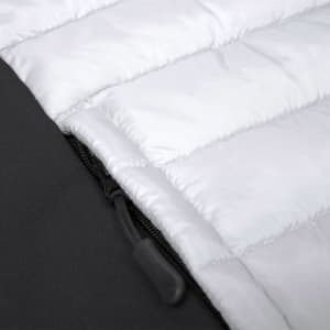 A soft shell jacket featuring a quilted white section with a black base, including a zipper detail.