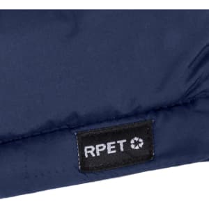 A navy puffer jacket with a label featuring a logo. The fabric appears smooth and insulated.