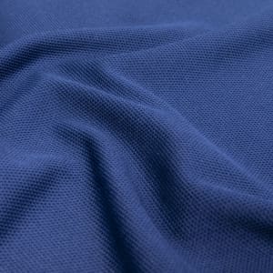 A textured deep navy fabric, featuring a breathable mesh pattern, ideal for polo shirts.