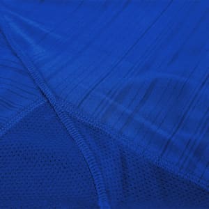A blue adult T-shirt featuring textured fabric and a mesh panel, designed for comfort and style.