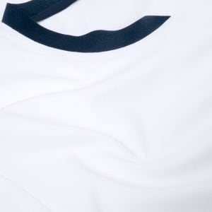 A white adult T-shirt featuring a navy blue collar and soft fabric texture, with a logo on the design.
