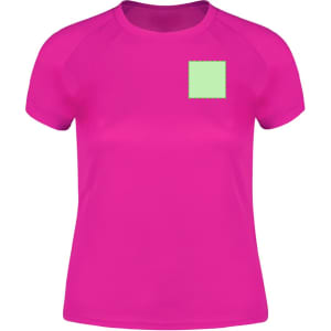 A bright pink women's T-shirt with short sleeves and a green square patch. It features a logo on the front.