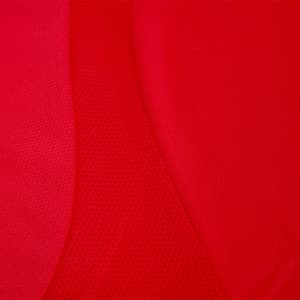 A vibrant red t-shirt featuring a mix of smooth and textured fabric, with a logo present.