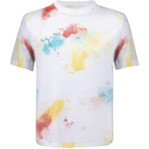 A white kids' t-shirt with a colourful splash pattern in red, yellow, and blue, featuring a logo.