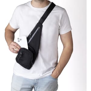 A black Fadaok shoulder bag worn across the body, featuring multiple zippered pockets and a person holding a smartphone.