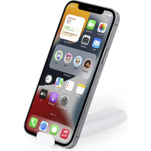 A smartphone displayed on a white stand, featuring a vibrant screen with various app icons visible.
