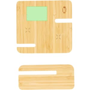 A wooden wireless charger with a light green section and cut-outs for a phone and accessories. It features a logo.