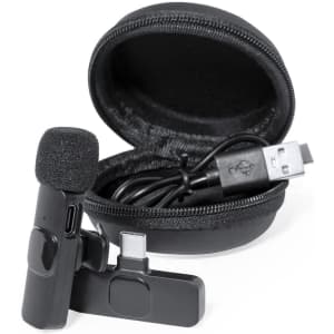 A black Spart Microphone with a foam cover, USB connection, and a compact carrying case.