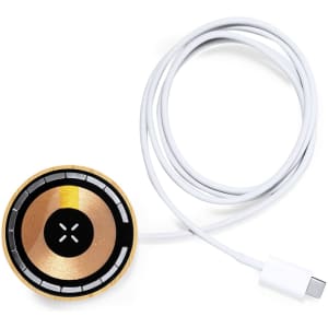 A round wireless charger in gold and black with a white cable. The product features a branding logo.