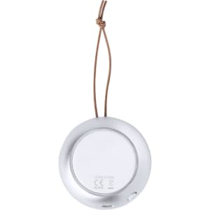 A round silver speaker with a white front and a brown hanging strap. It features a logo on the back.