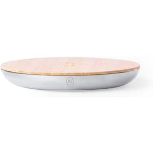 A wireless charger featuring a wooden top and a sleek silver base, with an embedded logo.