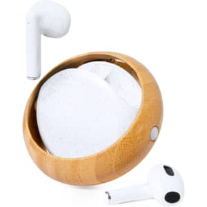 A pair of white earphones resting in a circular bamboo case. The case features a smooth finish.