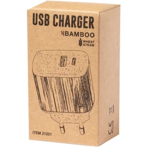 A USB charger in a brown cardboard box featuring a bamboo design and wheat straw elements. It has a logo on the packaging.