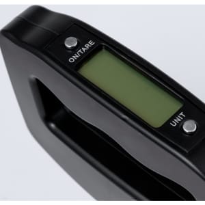 A black digital weighing scale with a green display screen and buttons for 'ON/TARE' and 'UNIT'.