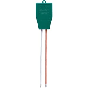 A green Pyrom Combitester tool with two metal probes, one white and one copper, for outdoor use.