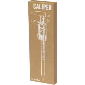 A caliper in a brown cardboard box featuring a simple white illustration and a logo.