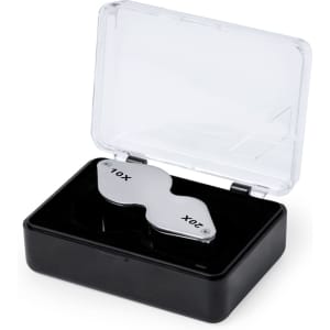 A magnifier with 10X and 20X lenses in a clear case, featuring a sleek silver design and black base.