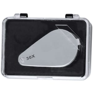A silver 30X magnifier in a clear protective case with a black interior, featuring a branding logo.