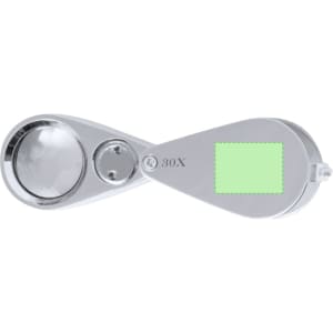 A silver magnifier with a 30X lens and a rectangular green area, featuring a logo on the side.